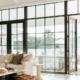 replacement doors Orange County, CA bright living room with black-framed glass patio doors