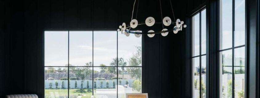 replacement windows Orange County, CA modern dining room with large black-framed windows