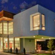 replacement windows Yorba Linda, CA modern two-story home with large glass windows