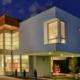 replacement windows Yorba Linda, CA modern two-story home with large glass windows