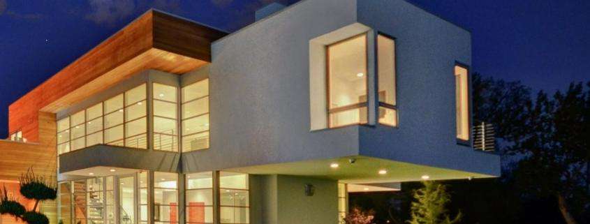 replacement windows Yorba Linda, CA modern two-story home with large glass windows