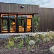 Modern home exterior featuring black-framed replacement doors in Yorba Linda, CA