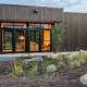 Modern home exterior featuring black-framed replacement doors in Yorba Linda, CA