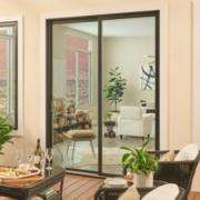 Modern black framed replacement doors in Yorba Linda, CA, opening to a bright outdoor patio