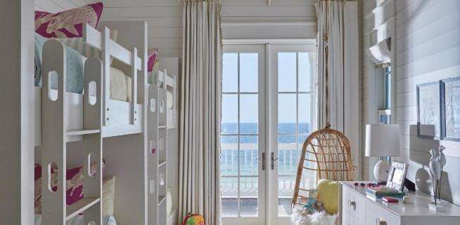Replacement doors Orange County, CA with white French patio doors opening to an ocean view