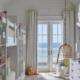 Replacement doors Orange County, CA with white French patio doors opening to an ocean view