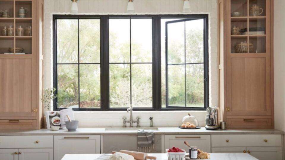 Newly installed replacement windows in a Yorba Linda, CA kitchen with dark frames