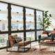 Replacement windows in Orange County, CA installed in a bright, modern living room with large energy-efficient windows.